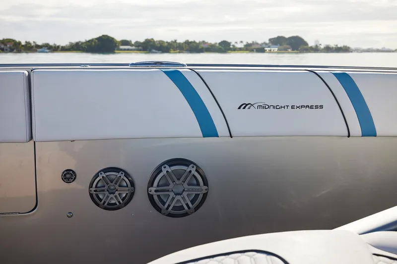  Yacht Photos Pics Midnight Express 43' Open boat interior with speakers and logo, featuring sleek design.