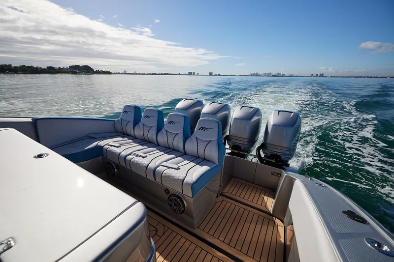  Yacht Photos Pics Luxury Midnight Express 43' Open boat cruising on calm waters, featuring powerful engines.