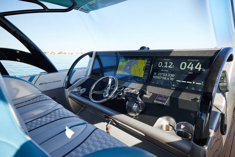  Yacht Photos Pics Midnight Express 43' Open boat cockpit with advanced navigation displays and steering wheel.