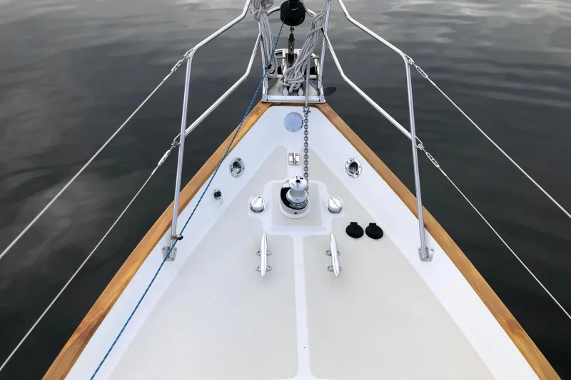 Murphy Yacht Photos Pics Bow of 2004 Pacific Seacraft 31 sailboat with anchor chain and wooden trim.