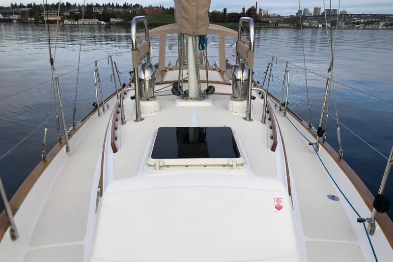 Murphy Yacht Photos Pics 2004 Pacific Seacraft 31 sailboat deck with polished fittings and calm waterfront view.