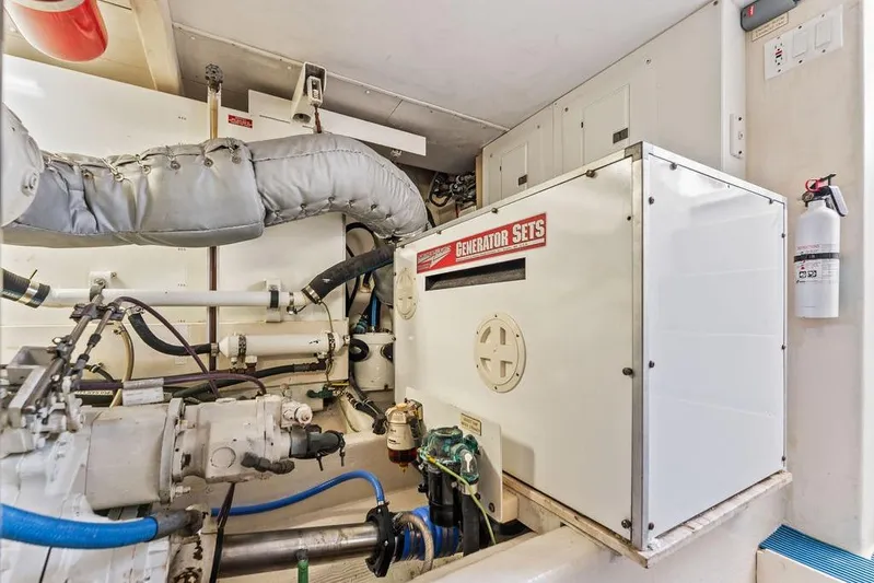 Five O' Clock Yacht Photos Pics Engine room of 2000 West Bay 58 Sonship yacht with generator and equipment.