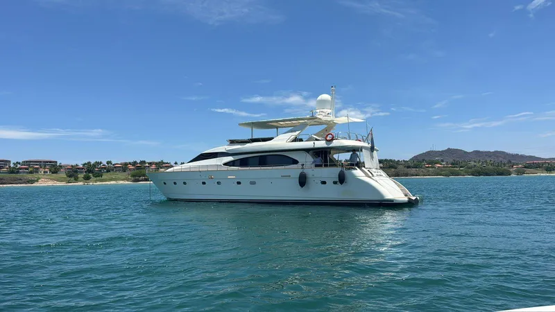 Yacht Photos Pics Luxurious 1998 Azimut Ultimate yacht cruising on serene blue waters under a clear sky.