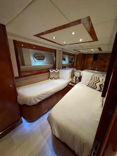  Yacht Photos Pics Luxurious cabin interior of 1998 Azimut Ultimate yacht with twin beds and elegant wood finish.