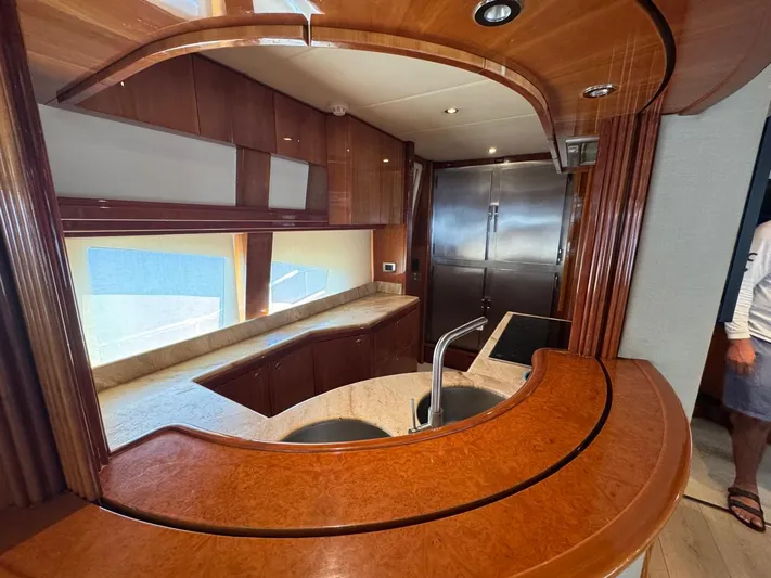  Yacht Photos Pics Luxurious 1998 Azimut Ultimate yacht interior with elegant wood finishes and modern kitchen design.