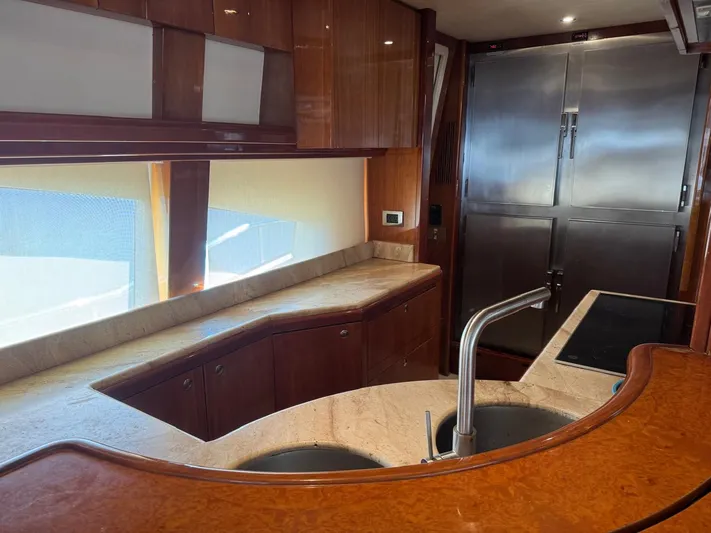  Yacht Photos Pics Luxurious kitchen interior of a 1998 Azimut Ultimate yacht with modern fixtures.