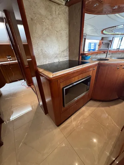  Yacht Photos Pics Luxurious 1998 Azimut Ultimate yacht interior with modern kitchen and elegant wood finishes.