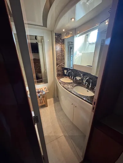  Yacht Photos Pics Luxurious bathroom in 1998 Azimut Ultimate yacht with dual sinks and elegant design.