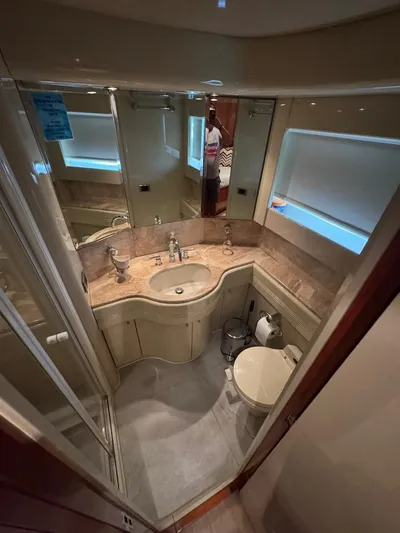  Yacht Photos Pics Luxurious bathroom in 1998 Azimut Ultimate yacht with elegant fixtures and modern design.