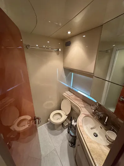  Yacht Photos Pics Luxurious bathroom in 1998 Azimut Ultimate yacht with modern fixtures and elegant design.