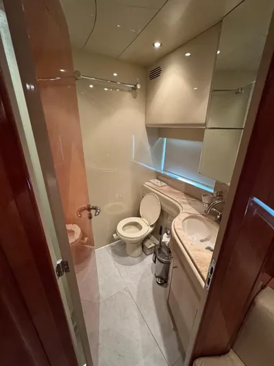  Yacht Photos Pics Luxurious bathroom in 1998 Azimut Ultimate yacht with modern fixtures and elegant design.