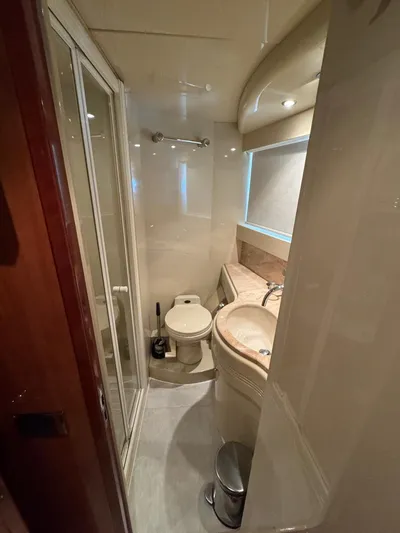  Yacht Photos Pics 1998 Azimut Ultimate yacht bathroom with shower, toilet, and sink.