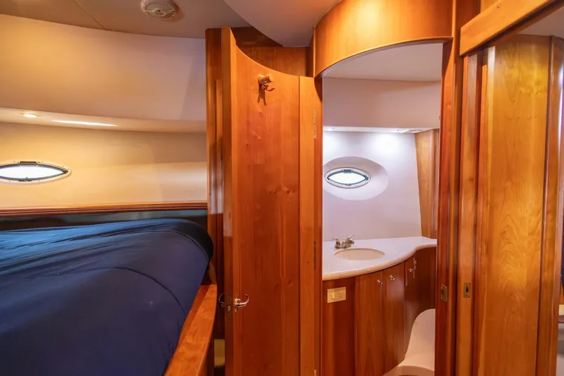 Blue Sapphire Yacht Photos Pics 2001 Silverton 410 Sport Bridge interior with wood finish and cozy cabin space.