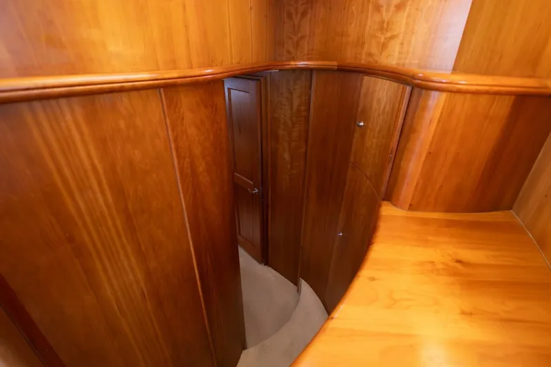 Blue Sapphire Yacht Photos Pics Interior of 2001 Silverton 410 Sport Bridge with polished wood paneling and door.