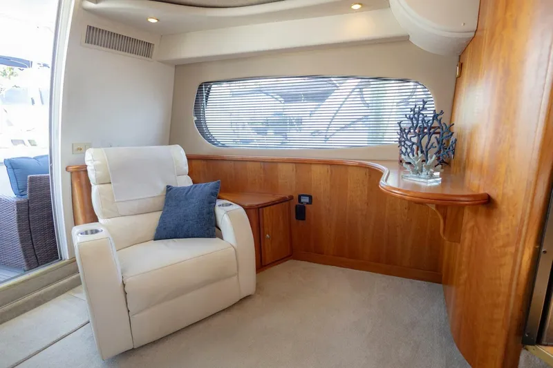 Blue Sapphire Yacht Photos Pics Luxurious interior of 2001 Silverton 410 Sport Bridge with plush seating and elegant wood accents.