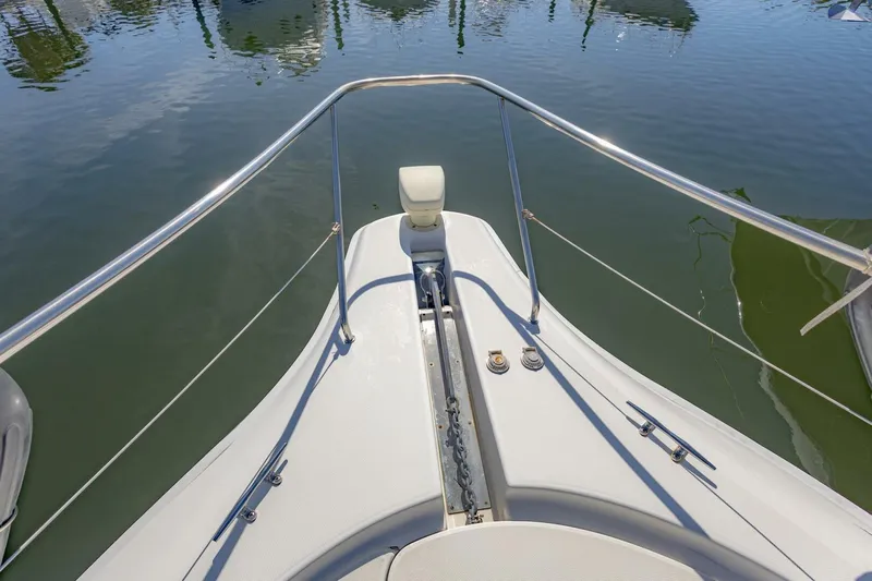 Blue Sapphire Yacht Photos Pics Bow view of 2001 Silverton 410 Sport Bridge yacht, featuring stainless steel railings.