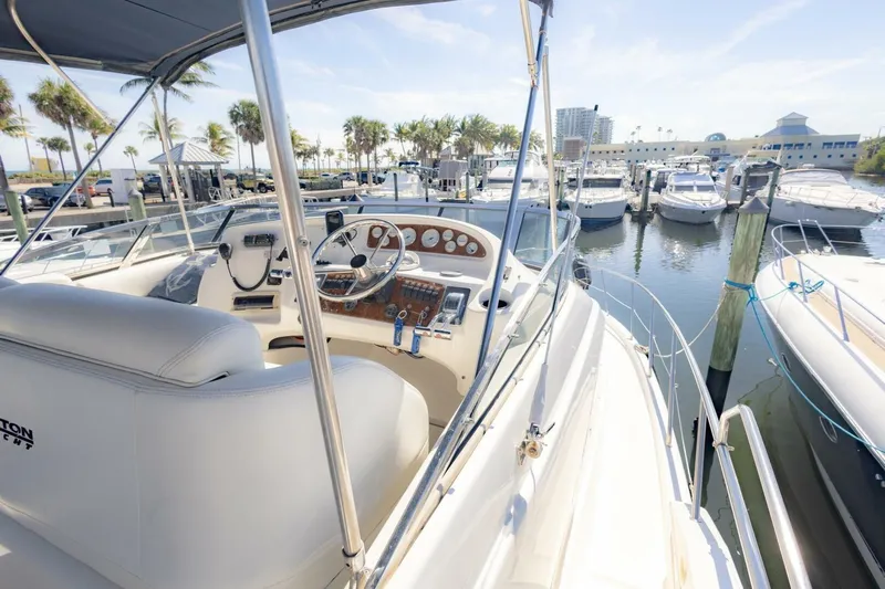 Blue Sapphire Yacht Photos Pics 2001 Silverton 410 Sport Bridge yacht at marina, featuring helm and docked boats.