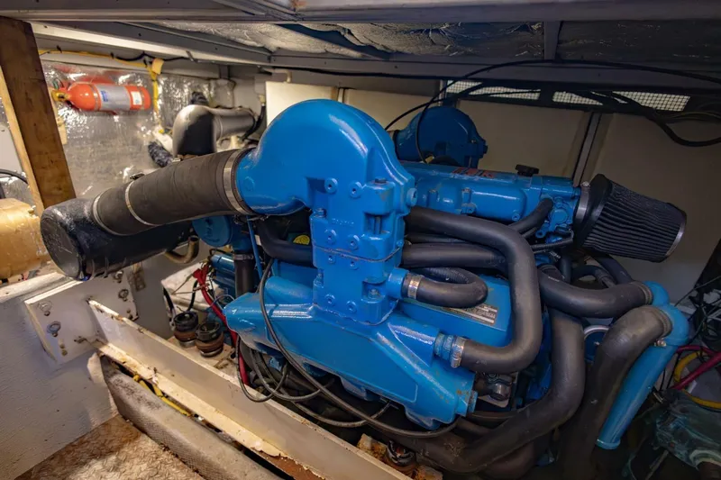 Blue Sapphire Yacht Photos Pics Engine room of a 2001 Silverton 410 Sport Bridge with blue marine engine.