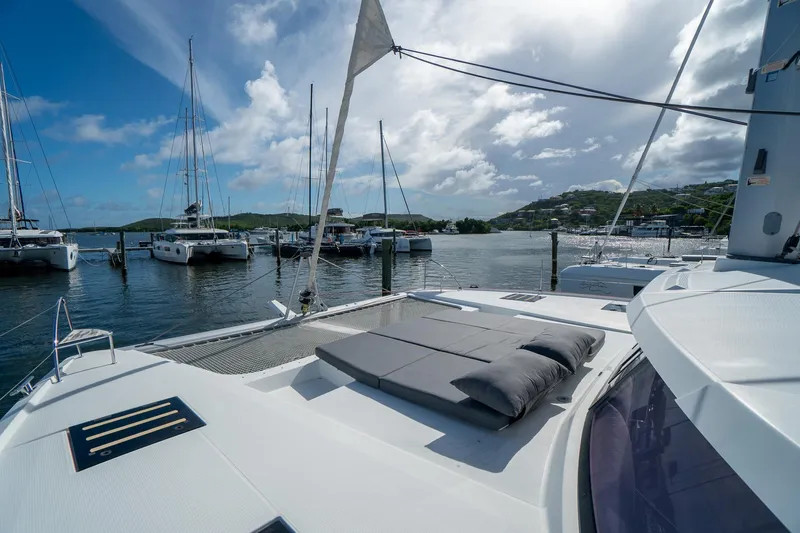 Hourglass Yacht Photos Pics Fountaine Pajot Saona 47 catamaran docked in a scenic marina, 2020 model.