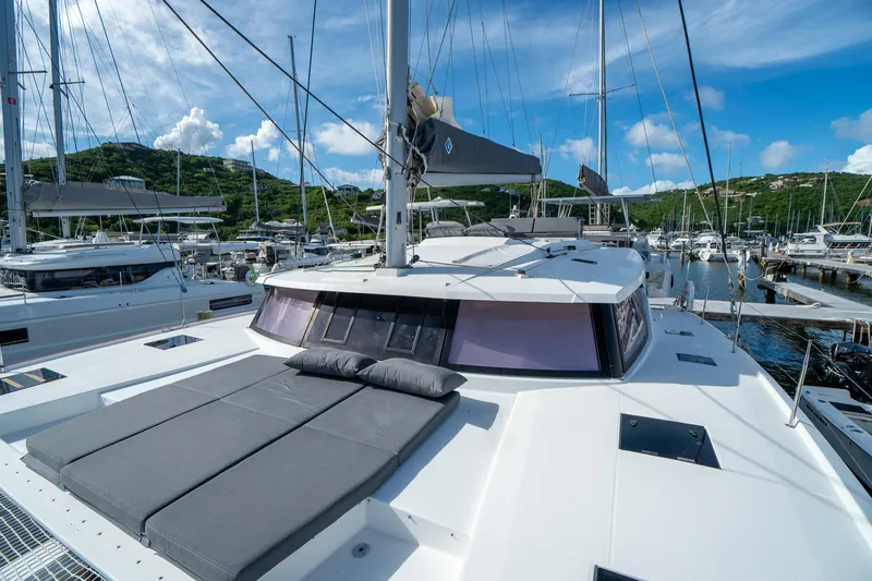 Hourglass Yacht Photos Pics Fountaine Pajot Saona 47 catamaran docked in marina, 2020 model, sunny day.