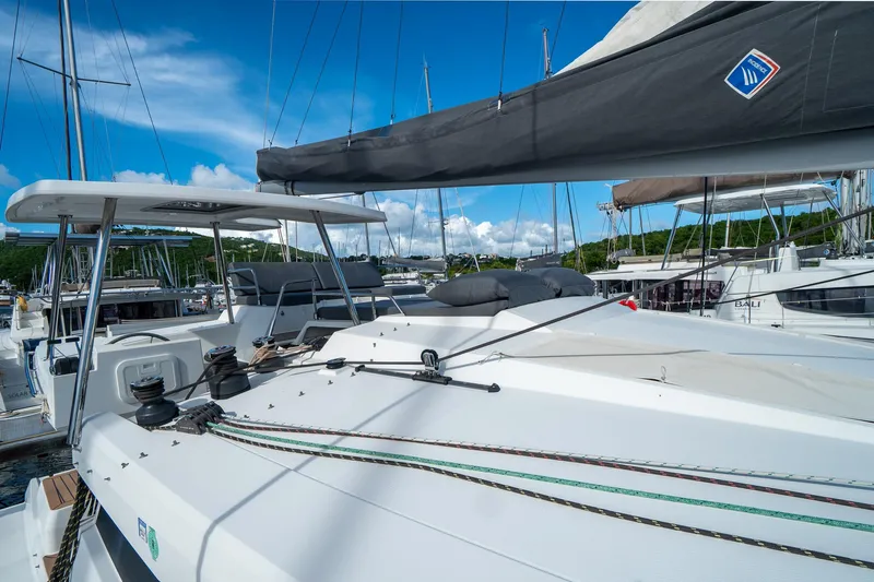Hourglass Yacht Photos Pics 2020 Fountaine Pajot Saona 47 catamaran docked, showcasing sleek design and spacious deck.
