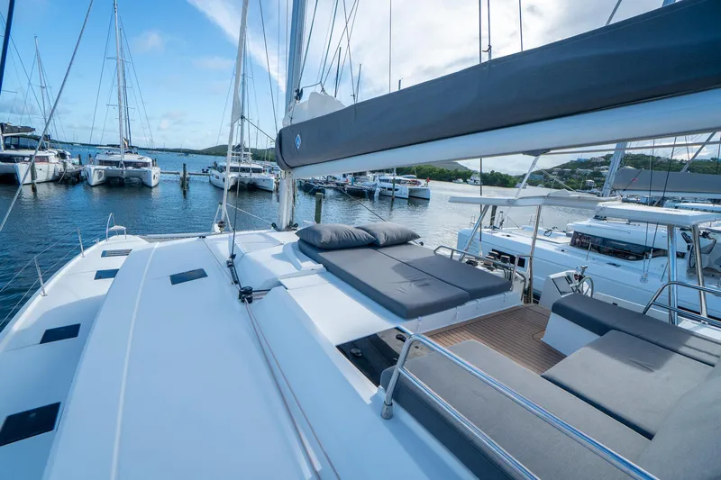 Hourglass Yacht Photos Pics 2020 Fountaine Pajot Saona 47 catamaran docked, featuring spacious deck and luxurious seating.