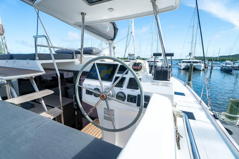 Hourglass Yacht Photos Pics 2020 Fountaine Pajot Saona 47 yacht helm with marina view.