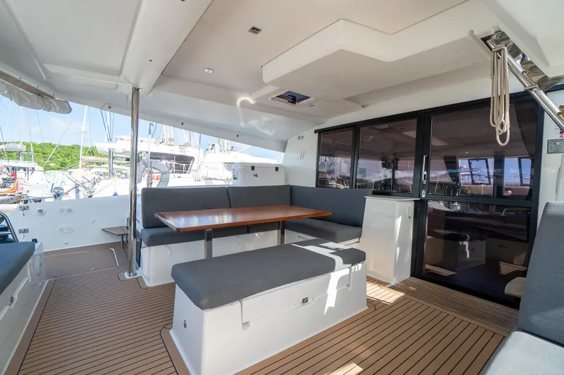 Hourglass Yacht Photos Pics Spacious deck area of 2020 Fountaine Pajot Saona 47 catamaran with seating and table.