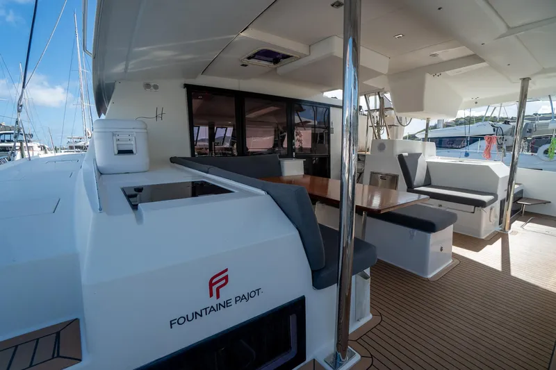 Hourglass Yacht Photos Pics 2020 Fountaine Pajot Saona 47 yacht with spacious outdoor seating and dining area.
