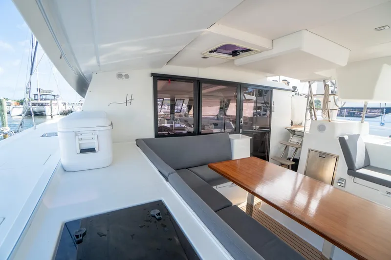 Hourglass Yacht Photos Pics 2020 Fountaine Pajot Saona 47 yacht with spacious outdoor seating and dining area.