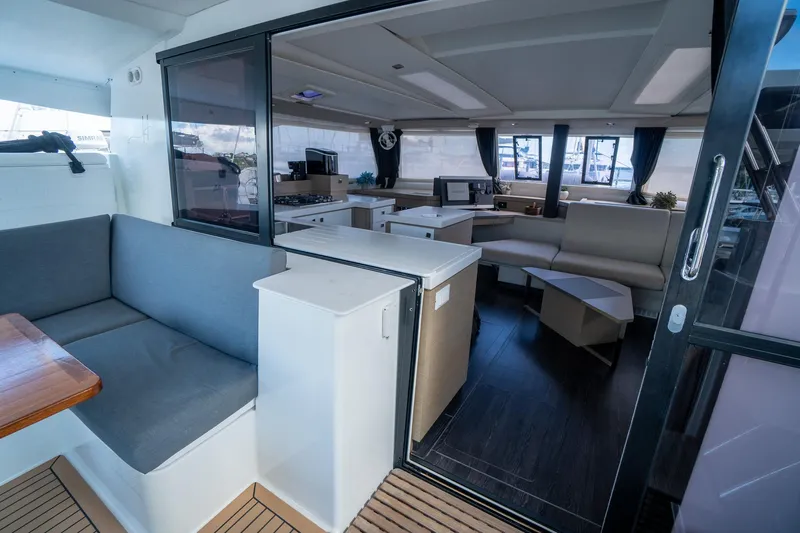 Hourglass Yacht Photos Pics Interior of 2020 Fountaine Pajot Saona 47 catamaran, featuring modern seating and spacious design.
