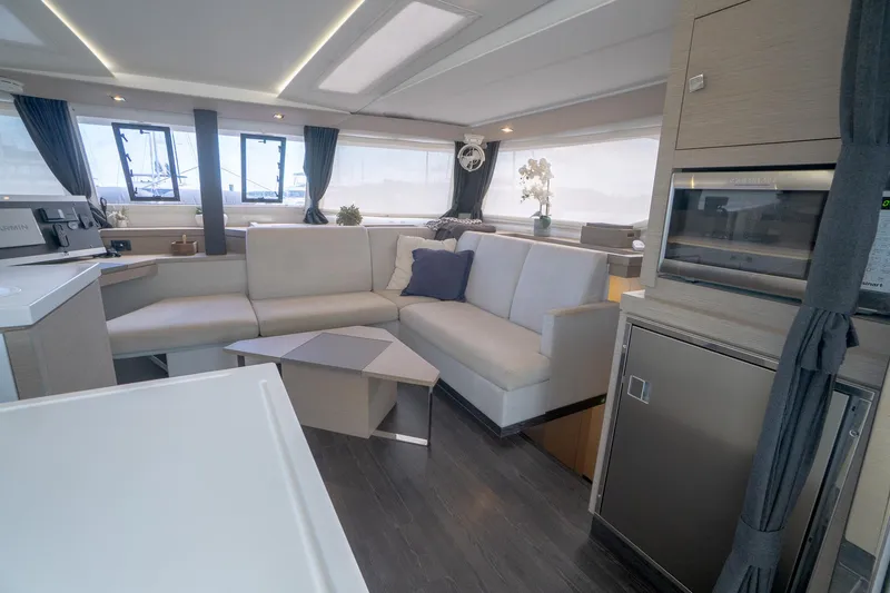 Hourglass Yacht Photos Pics Luxurious interior of 2020 Fountaine Pajot Saona 47 catamaran with modern furnishings.