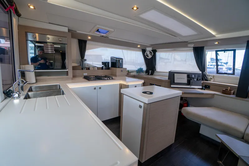 Hourglass Yacht Photos Pics Modern kitchen interior of 2020 Fountaine Pajot Saona 47 catamaran with sleek design.