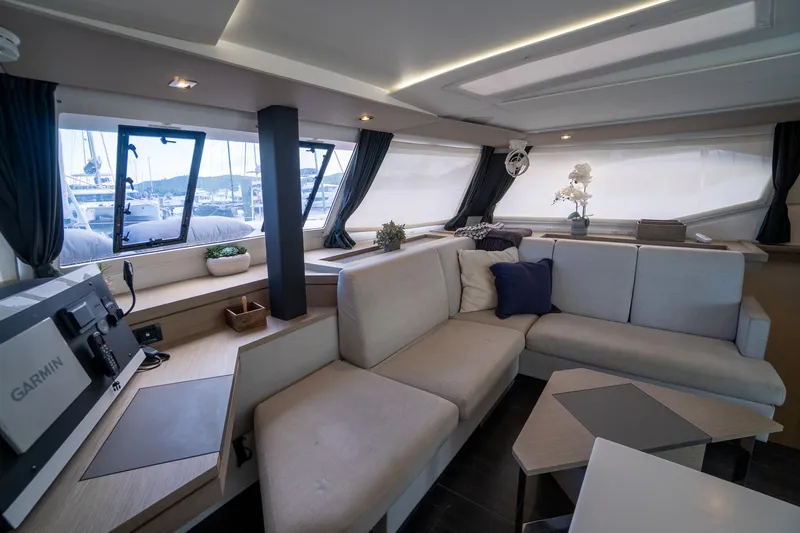 Hourglass Yacht Photos Pics Luxurious interior of 2020 Fountaine Pajot Saona 47 catamaran with modern seating and decor.