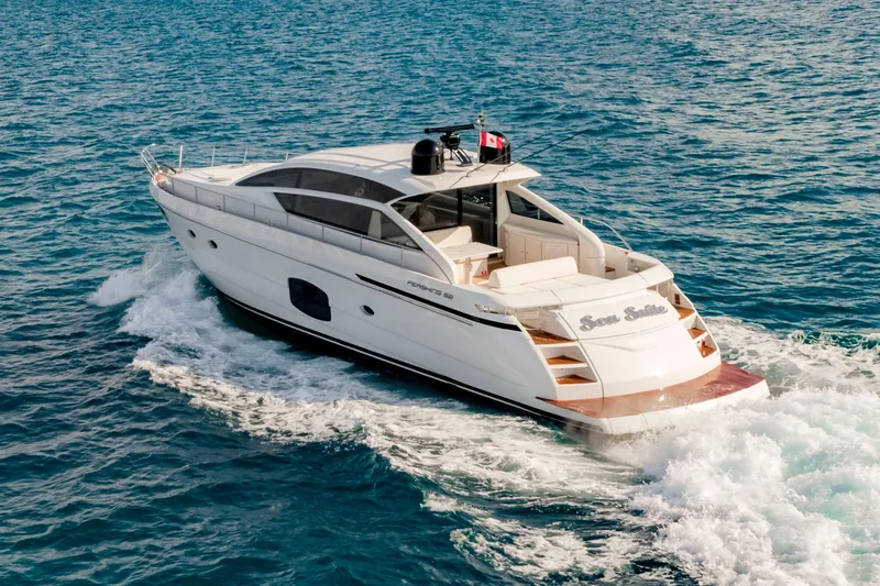 Sea Suite Yacht Photos Pics 2021 Pershing 62 yacht cruising on open water, showcasing sleek design and luxury features.