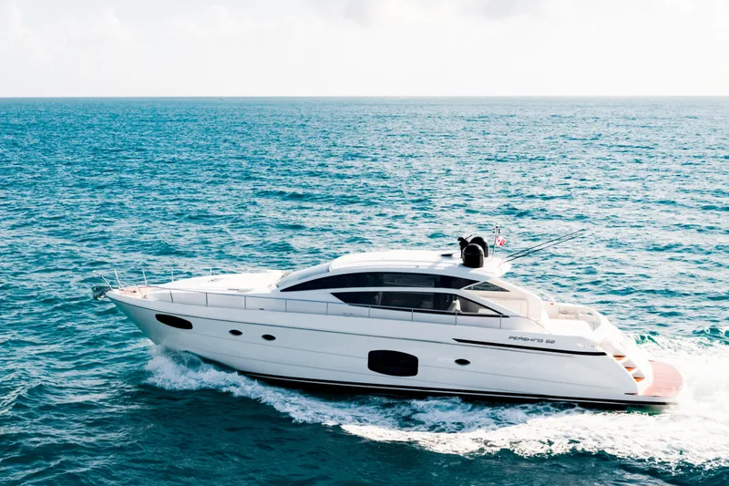 Sea Suite Yacht Photos Pics 2021 Pershing 62 yacht cruising on open sea under clear skies.