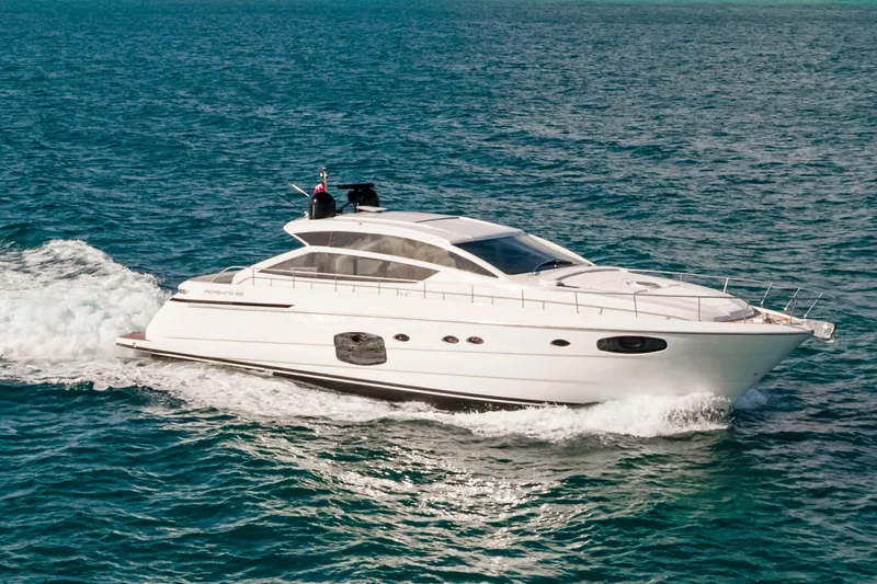 Sea Suite Yacht Photos Pics 2021 Pershing 62 yacht cruising on open water, showcasing sleek design and luxury.