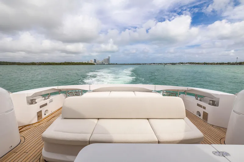 Sea Suite Yacht Photos Pics Luxury Pershing 62 yacht cruising on open water, 2021 model, with scenic ocean view.