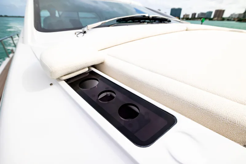 Sea Suite Yacht Photos Pics 2021 Pershing 62 yacht deck with cup holders and cushioned seating.