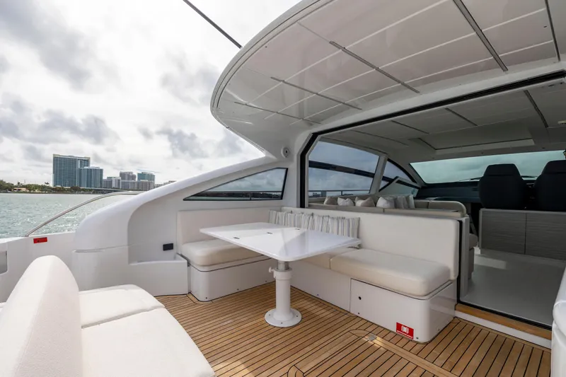 Sea Suite Yacht Photos Pics Luxurious 2021 Pershing 62 yacht interior with elegant seating and ocean view.