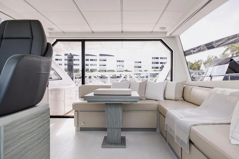 Sea Suite Yacht Photos Pics Luxurious interior of 2021 Pershing 62 yacht with elegant seating and modern design.