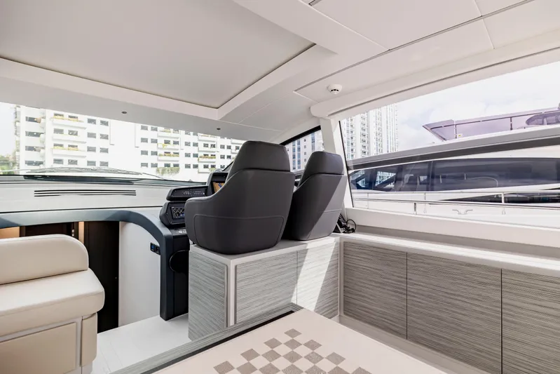Sea Suite Yacht Photos Pics Luxurious interior of 2021 Pershing 62 yacht with modern seating and sleek design.