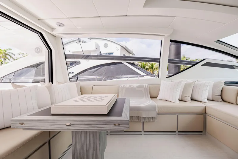 Sea Suite Yacht Photos Pics Luxurious interior of 2021 Pershing 62 yacht with elegant seating and modern design.