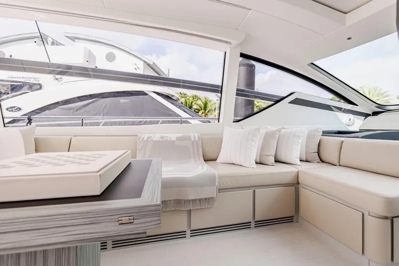 Sea Suite Yacht Photos Pics Luxurious interior of 2021 Pershing 62 yacht with elegant seating and modern design.