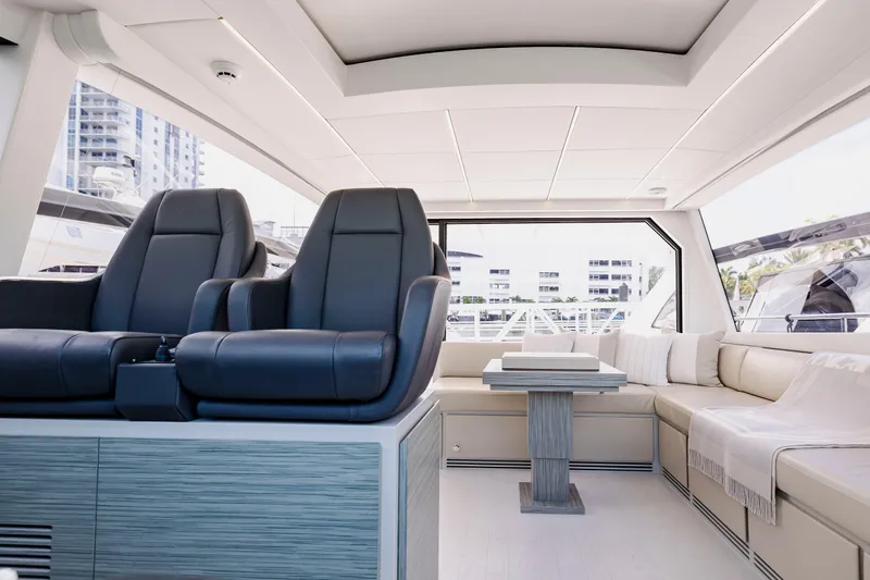 Sea Suite Yacht Photos Pics Luxurious interior of 2021 Pershing 62 yacht with plush seating and modern design.