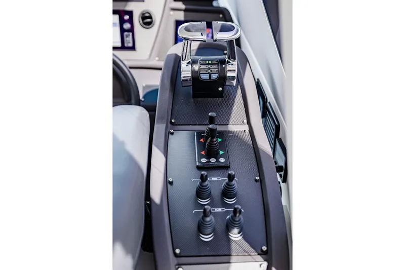 Sea Suite Yacht Photos Pics Control panel of 2021 Pershing 62 yacht with joysticks and throttle levers.