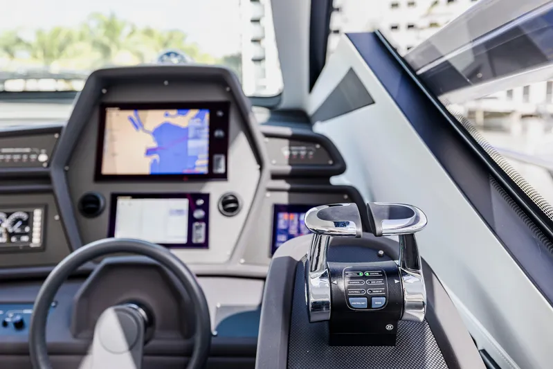 Sea Suite Yacht Photos Pics Cockpit of 2021 Pershing 62 yacht with navigation screens and controls.