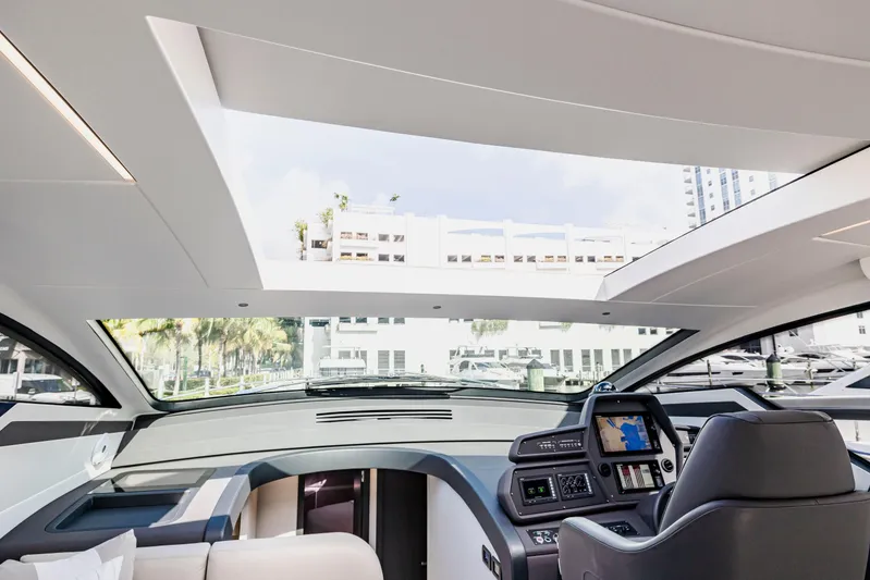 Sea Suite Yacht Photos Pics Interior view of 2021 Pershing 62 yacht cockpit with modern navigation system.