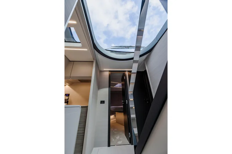 Sea Suite Yacht Photos Pics Interior view of 2021 Pershing 62 yacht with skylight and modern design.