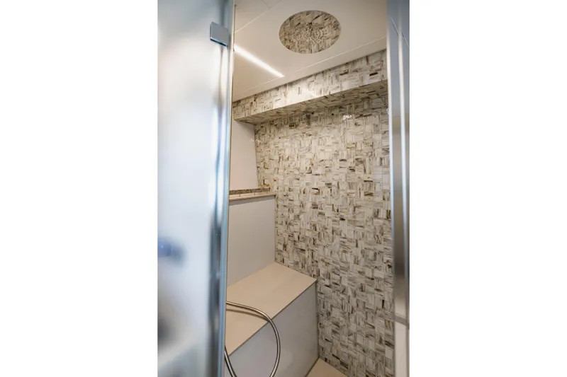 Sea Suite Yacht Photos Pics Luxurious bathroom interior on 2021 Pershing 62 yacht with modern tile design.